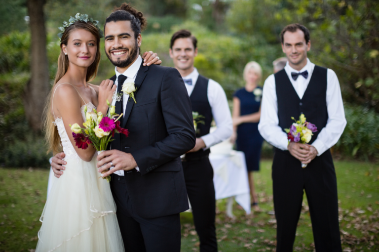 wedding-couple-standing-with-bouquet-of-flowers-in-2023-11-27-04-55-21-utc